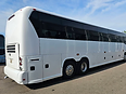2009 MCI J4500 motorcoach, passenger side rear three-quarter view