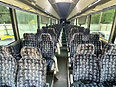 2009 MCI J4500 motorcoach, interior cabin looking down the center aisle