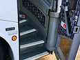 2009 MCI J4500 motorcoach, entry stairwell and passenger door