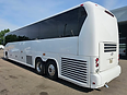 2009 MCI J4500 motorcoach, rear three-quarter view