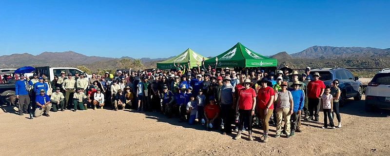 Volunteers cleaning a desert riverbank
