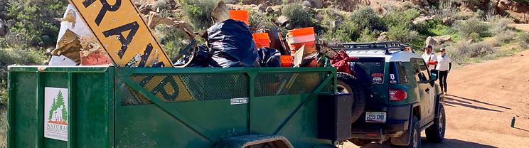 Natural Restorations cleanup crew hauling debris from the Tonto