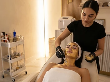 Editorial depiction of Anavaya's Cleopatra Facial with a gold-toned mask