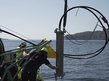 Lowering a test unit from a boat