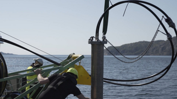 Lowering a Waterfountain test unit into the sea