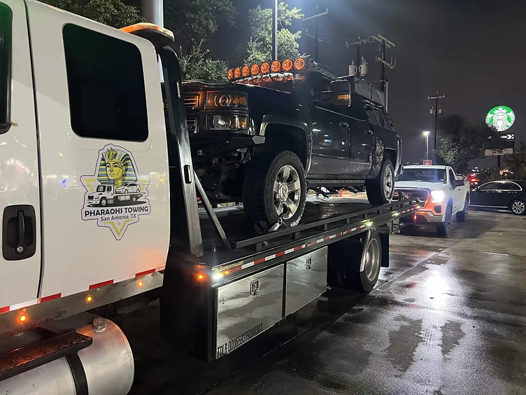 Pharaohs Towing heavy-duty pickup truck recovered at night