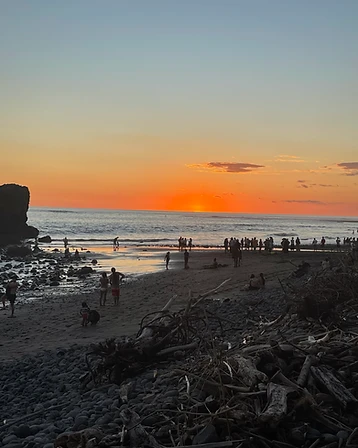People watching the sunset over the Pacific in El Tunco