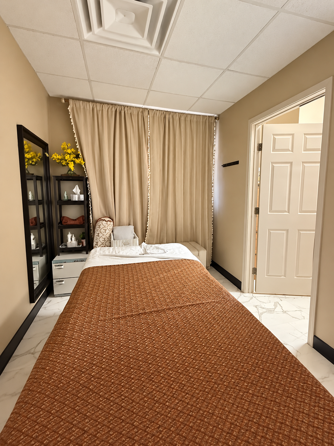 Private treatment room with sunflower art