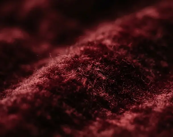 The fabric of the red couch