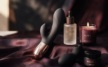Luxury intimate products in silicone, steel and glass on dark silk
