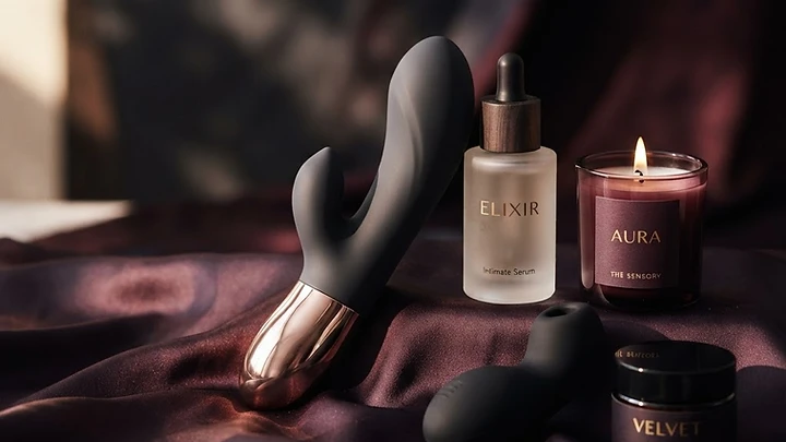 Luxury intimate products in silicone, steel and glass on dark silk