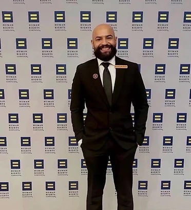 Cumbre Group founder at a Human Rights Campaign community event