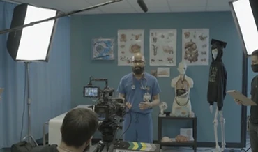 Cumbre Group production crew filming a workforce training session with a healthcare instructor on set
