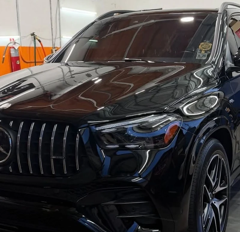 High-gloss black Mercedes-Benz SUV parked inside the GetRight Detailing shop in South Hackensack NJ