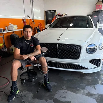 GetRight Detailing owner John in the South Hackensack NJ shop with a white Bentley
