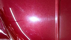 Red metallic paint with swirl marks before correction at GetRight Detailing in South Hackensack NJ