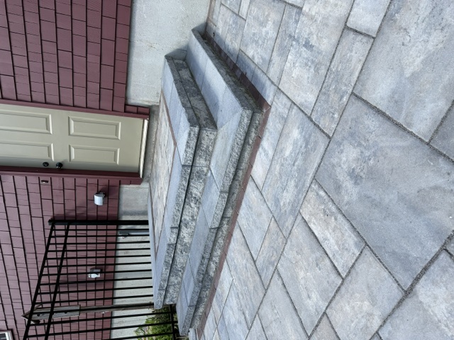 Granite step landing and paver patio built at a rear home entrance in North Smithfield, RI