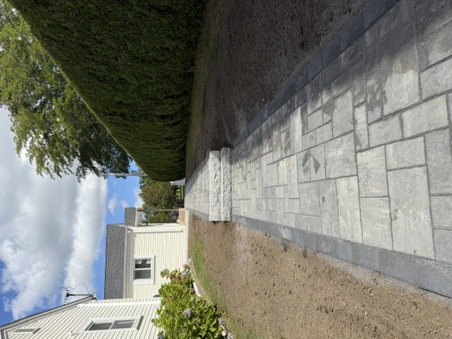 Long paver walkway with granite steps leading to a front entrance in North Smithfield, RI