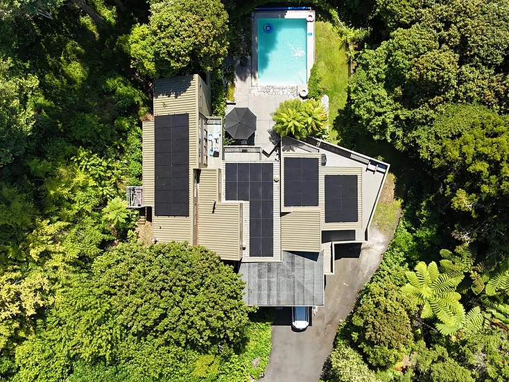 Residential solar installation across multiple roof areas on a Hamilton home with swimming pool
