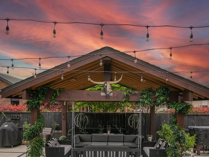 Outdoor entertaining area with festoon lighting at a Hamilton home