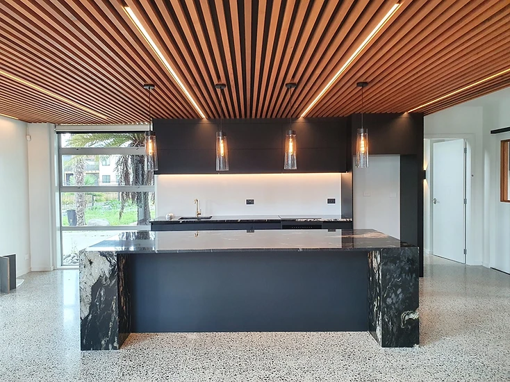 Architectural kitchen lighting with timber ceiling, linear lighting and pendant lights installed in a Hamilton home