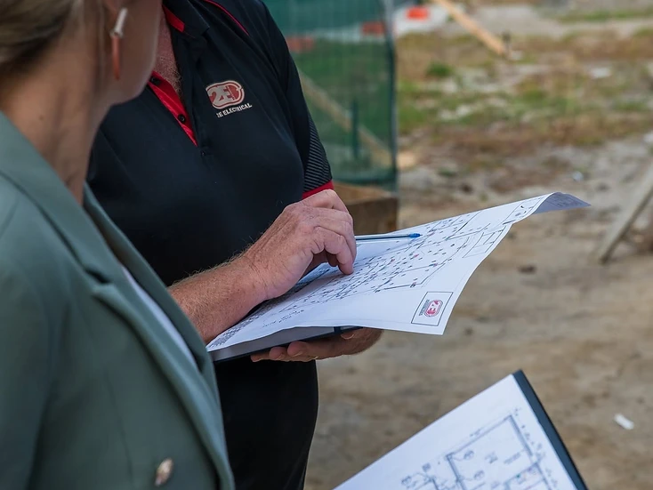 2E Electrical reviewing electrical plans on a new home construction site