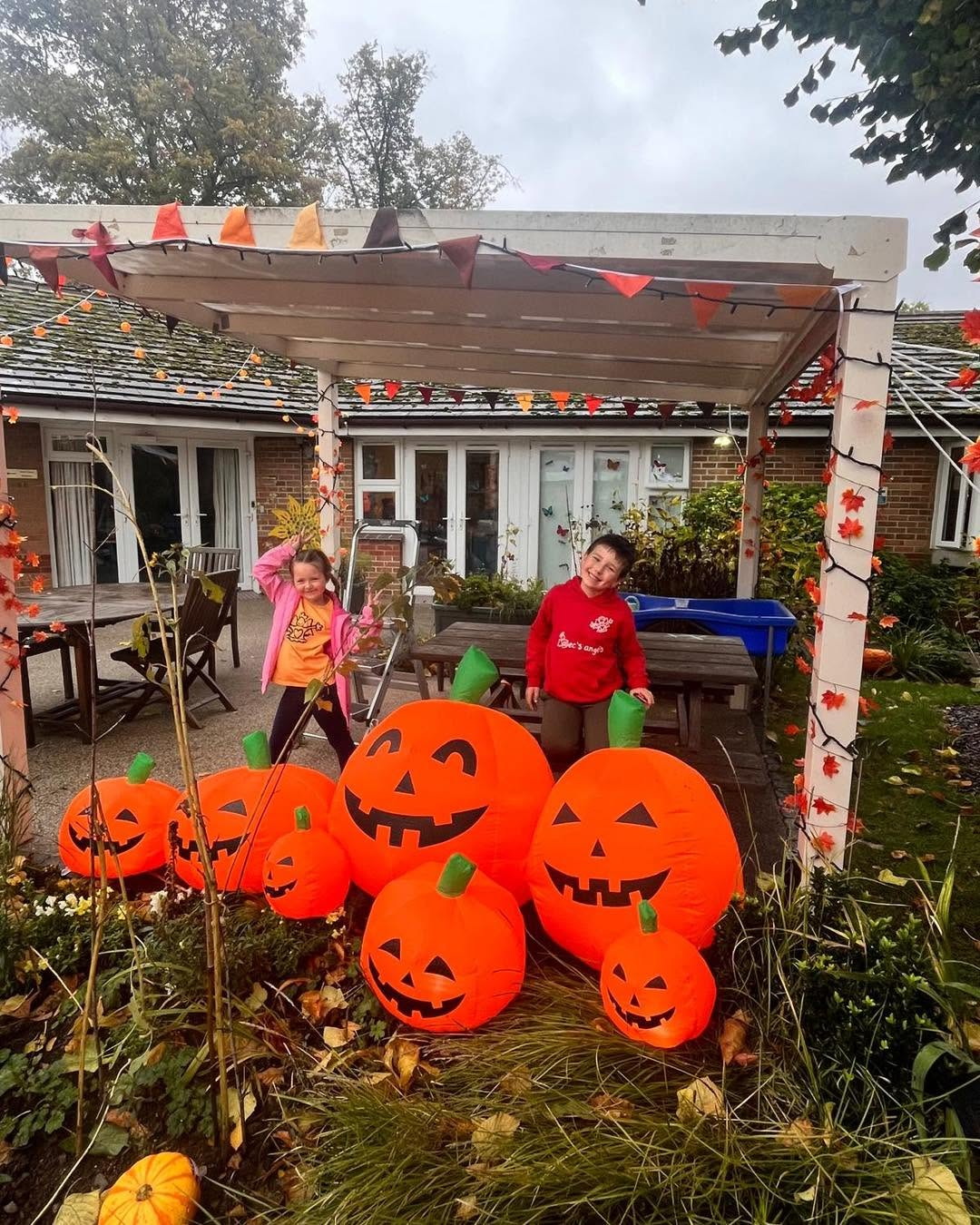 Autumn pumpkin display under a pergola