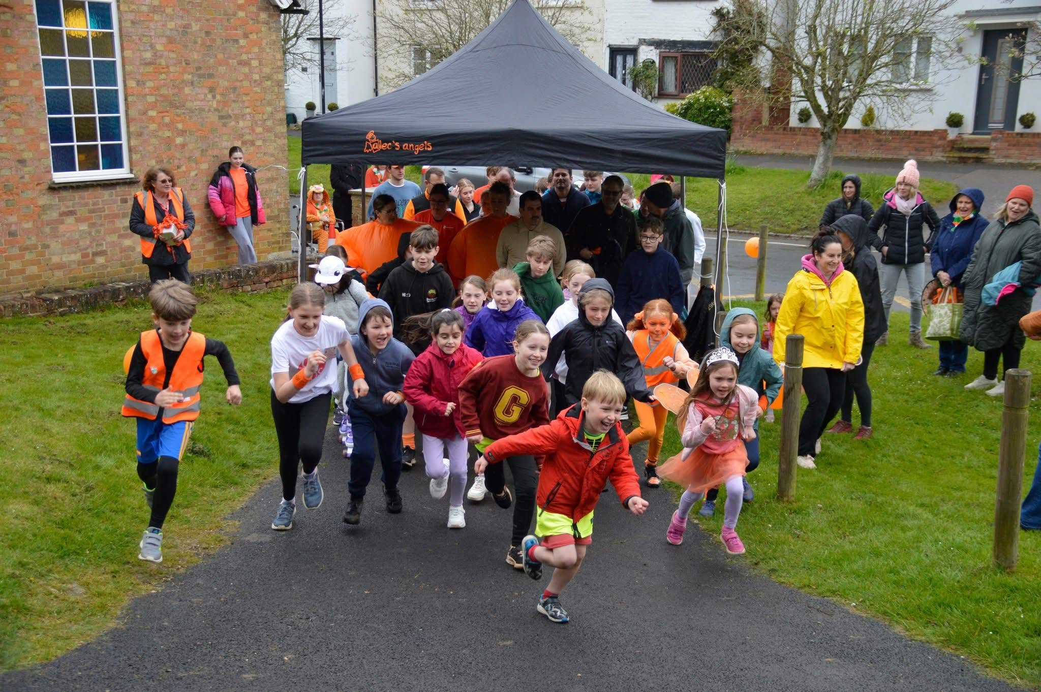 Children running in a charity fun run