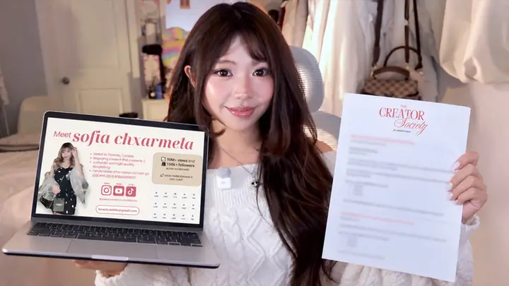 Sofia holding her UGC portfolio and pitch templates