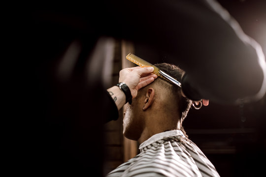 Barber cutting a client's hair