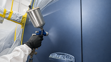Commercial truck cab being spray painted at Truck World