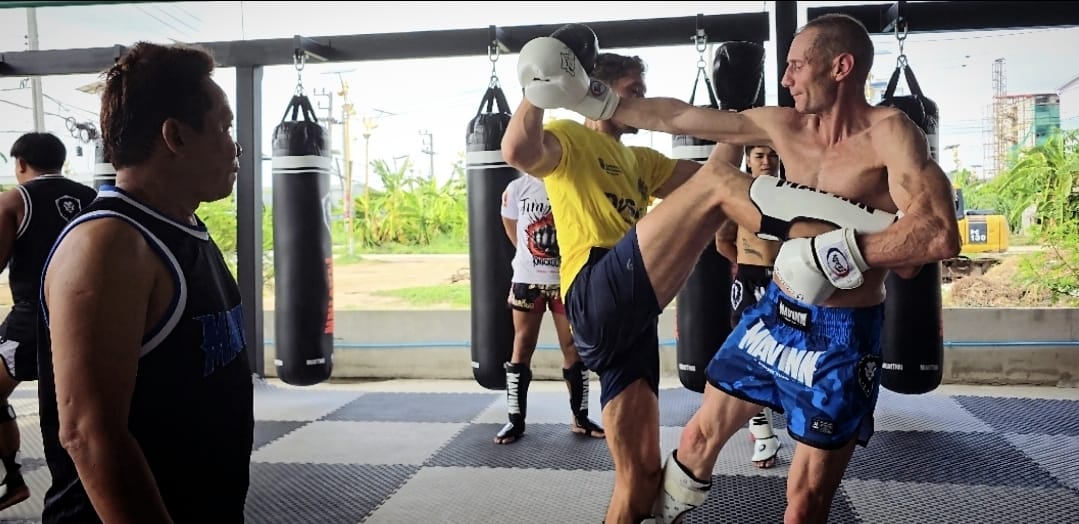 Muay Thai roundhouse kick on the pads at CH Muay Thai