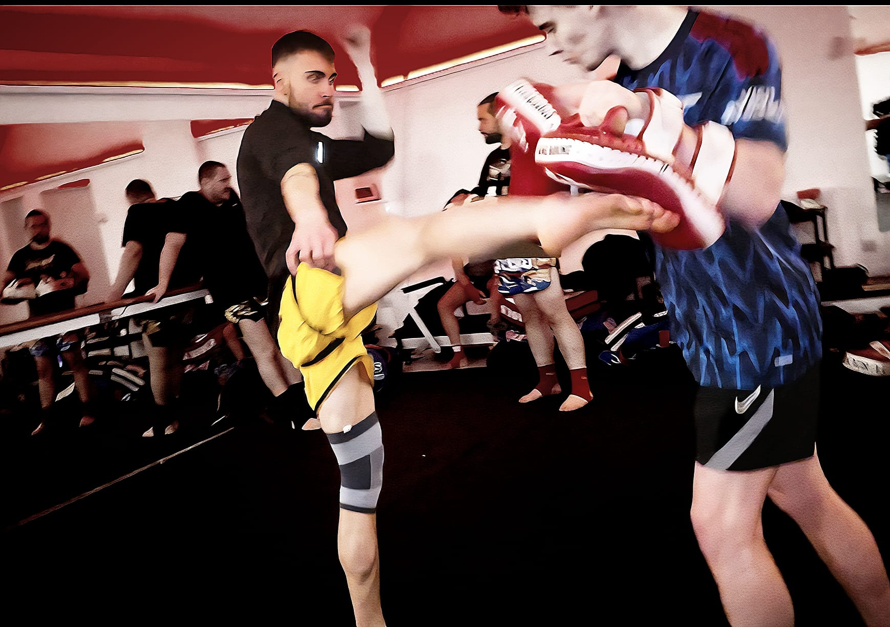Pad work roundhouse kick at the camp
