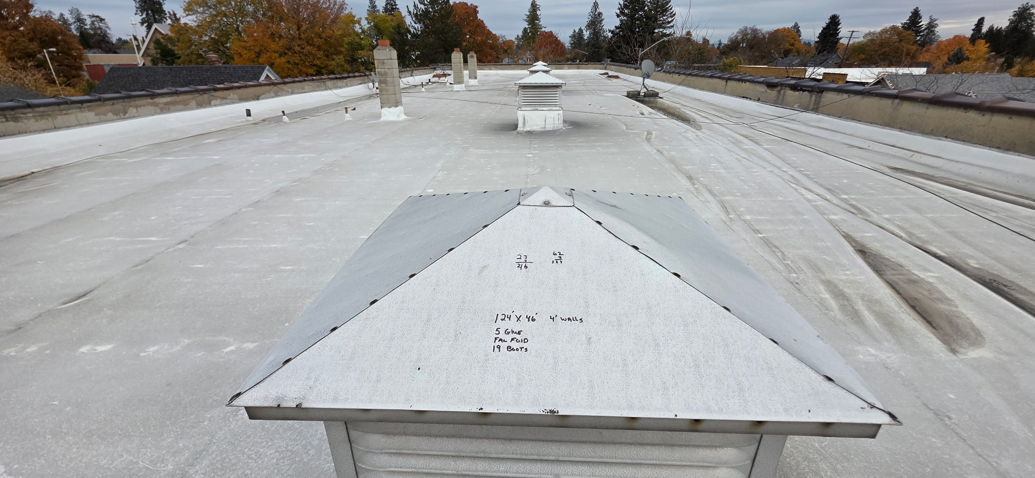 Alpha LLC inspecting a commercial flat roof