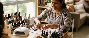 A home nail art station with a UV lamp and rows of polish bottles
