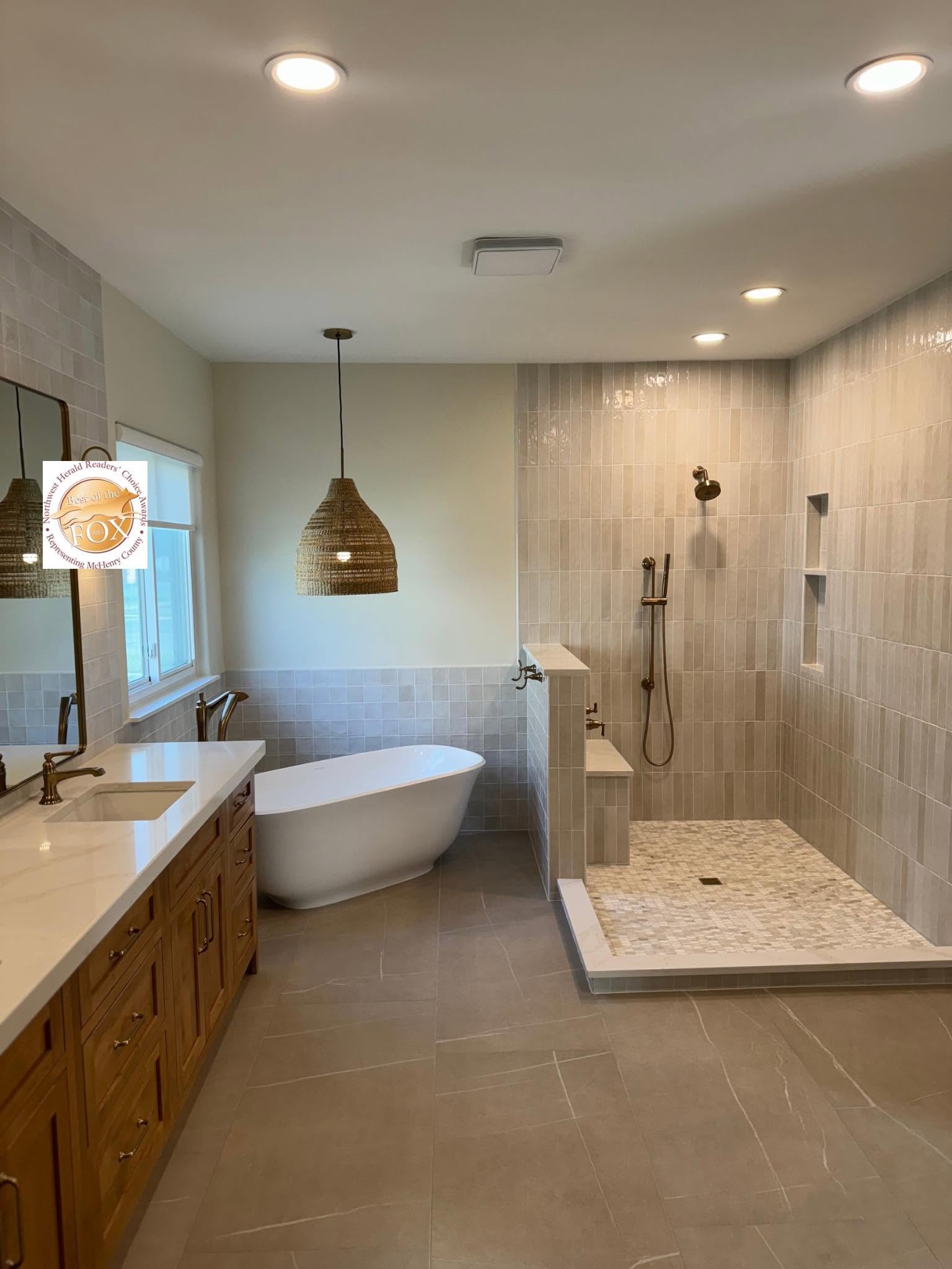Master bathroom with freestanding tub, walk-in shower and wood vanity by Fisher Remodeling