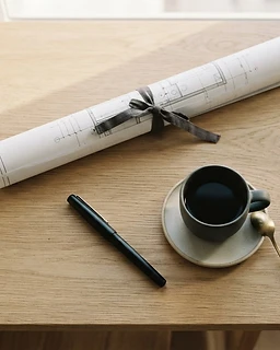 Minimalist workspace — blueprint and fountain pen