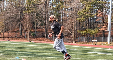 Athlete training on turf