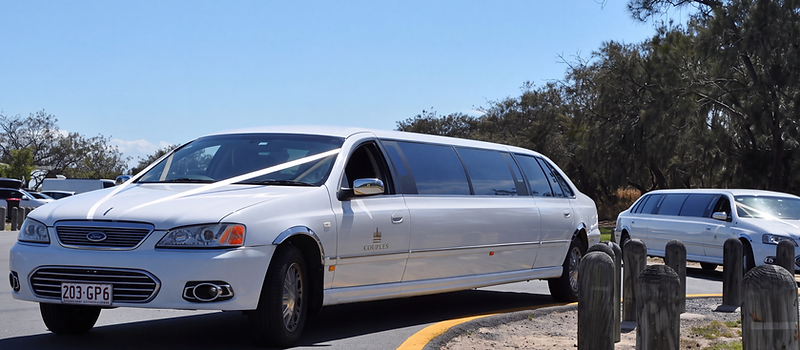 White stretch limousines outdoors
