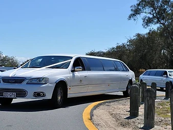 Twin White Limousines, seating for 20 passengers