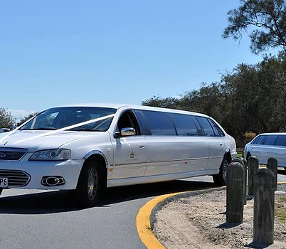 Twin white limousines for a special event
