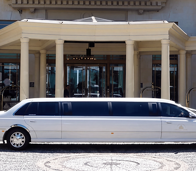 White stretch limousine outside a building