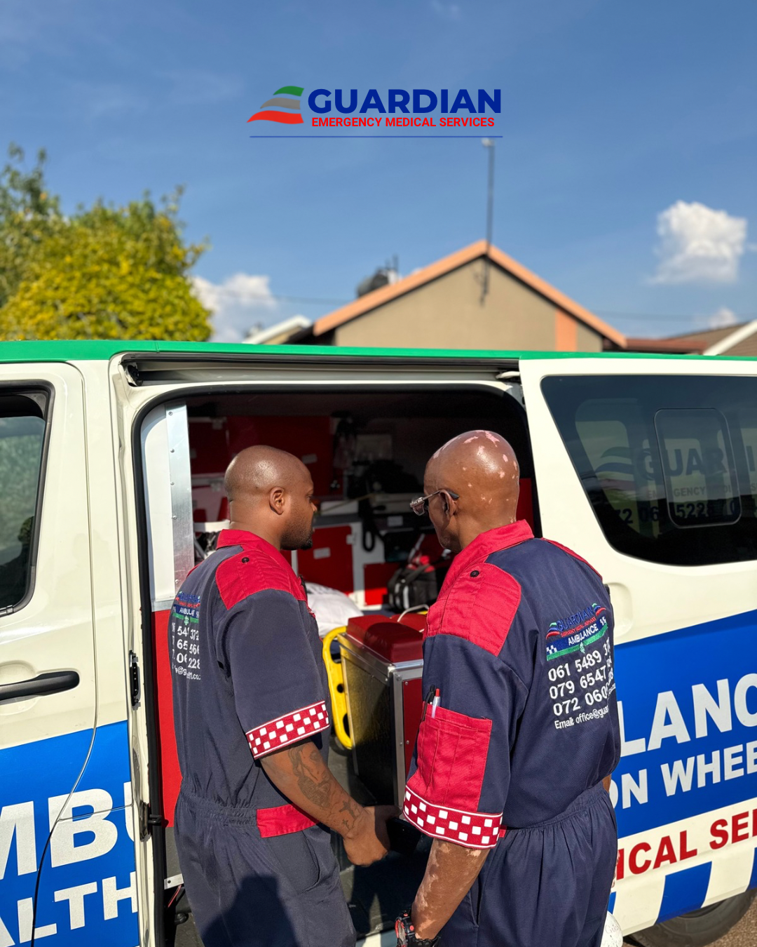 Guardian EMS paramedics providing patient care inside an ambulance during a transfer