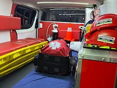 Interior of a Guardian EMS ambulance equipped with medical gear and stretcher