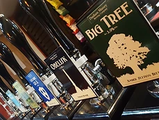 Close-up of beer handpumps at Costello's Bar, featuring Dunham Massey Brewing Company pump clips