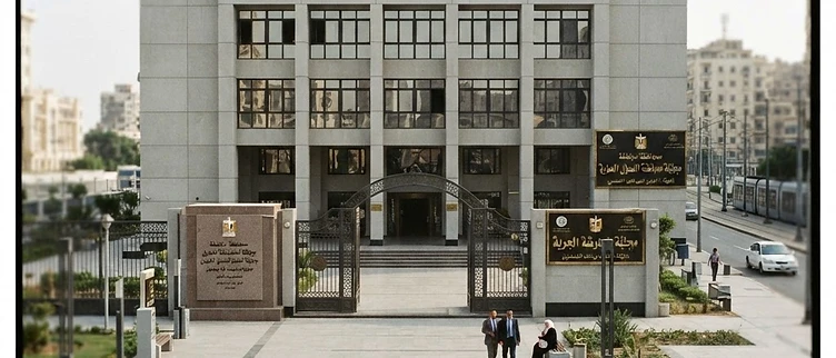 The formal stone entrance and official brass signage of the Alexandria Governorate urban development agency building in Alexandria, Egypt.