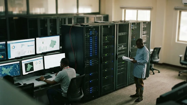 Illuminated digital monitoring screens and server cabinets fill the data command center at the Enugu State Government House in Enugu City.
