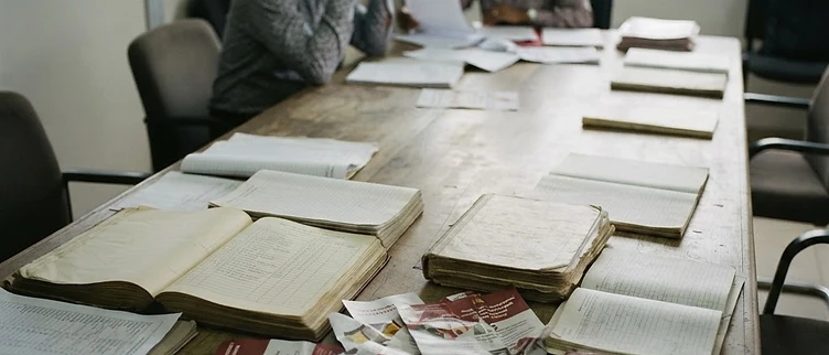 Official party membership rolls and strategy documents rest on a conference table inside the Cameroon Renaissance Movement headquarters in Yaoundé.