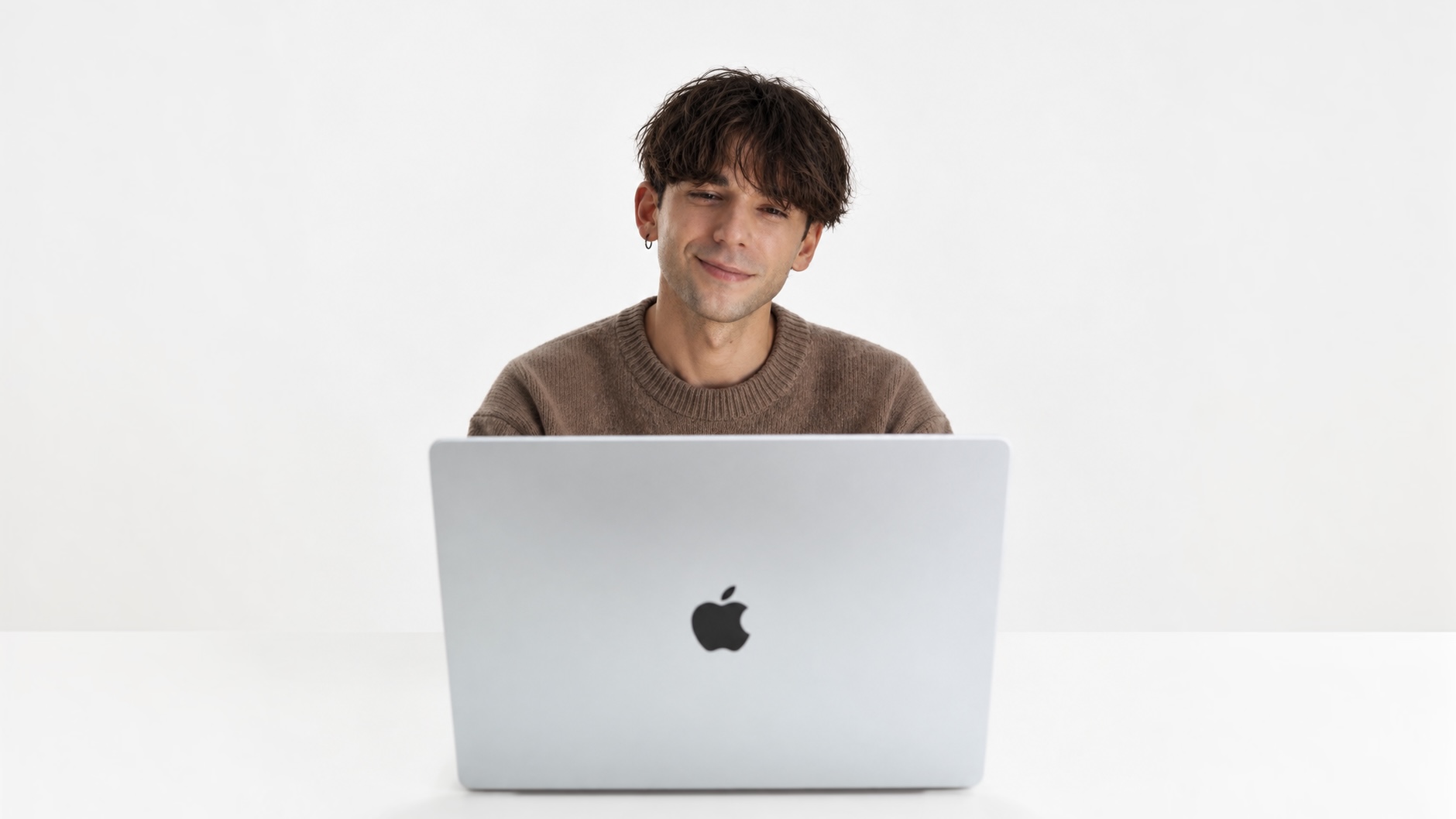 Bart Pan smiling at his laptop