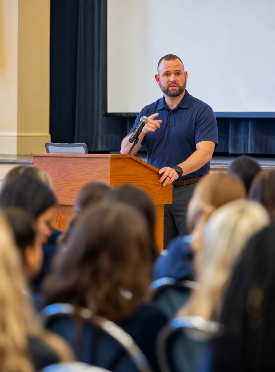 Instructor presenting traffic safety education to a student audience
